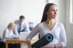 Business woman with yoga mat image